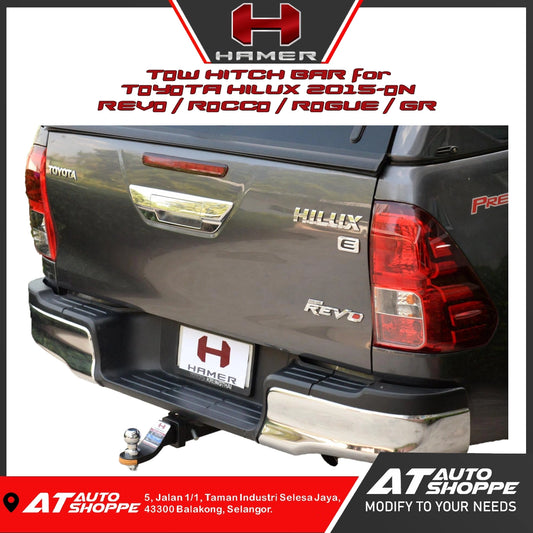 Toyota Hilux with a tow hitch bar labeled 'Hammer' on a white background.
