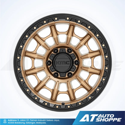 Gold and black alloy wheel with KMC logo on a white background, featuring AT Auto Shoppe branding.