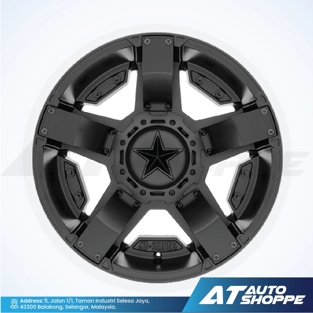 Black alloy wheel with star design on a white background, featuring AT Auto Shoppe branding.