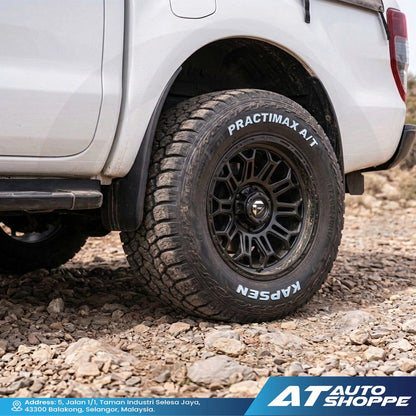 Off-road vehicle tire with KAPSEN branding on a rocky terrain, featuring 'AT Auto Shoppe' logo.