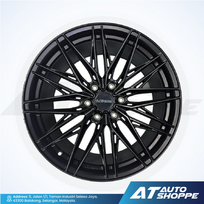 Black alloy wheel with 'AT Auto Shoppe' branding on a white background