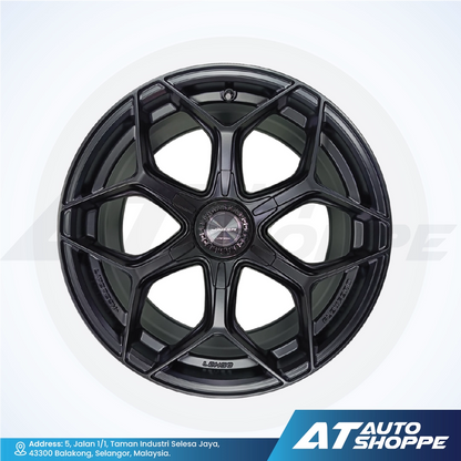 Black alloy wheel on a white background with AT Auto Shoppe branding.