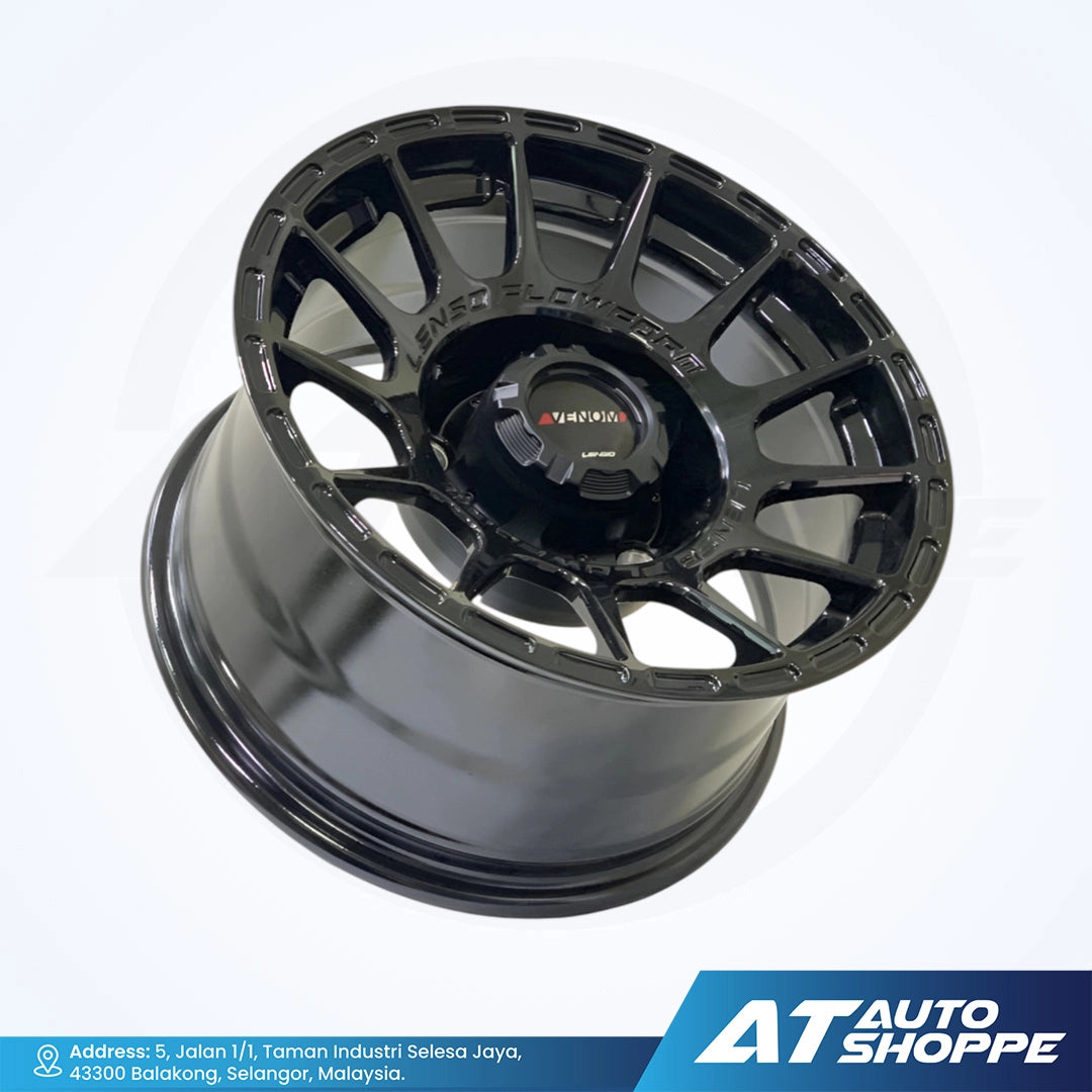 Black alloy wheel on a white background with AT Auto Shoppe branding.