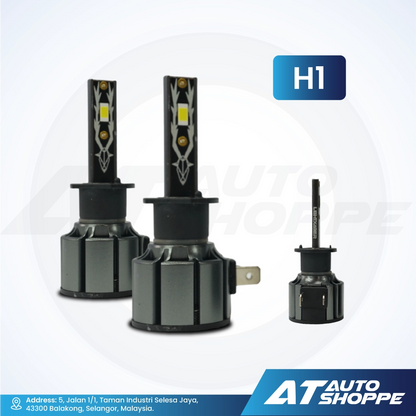 Two car headlight bulbs with a third bulb on a white background, featuring the brand 'AT Auto Shoppe'.