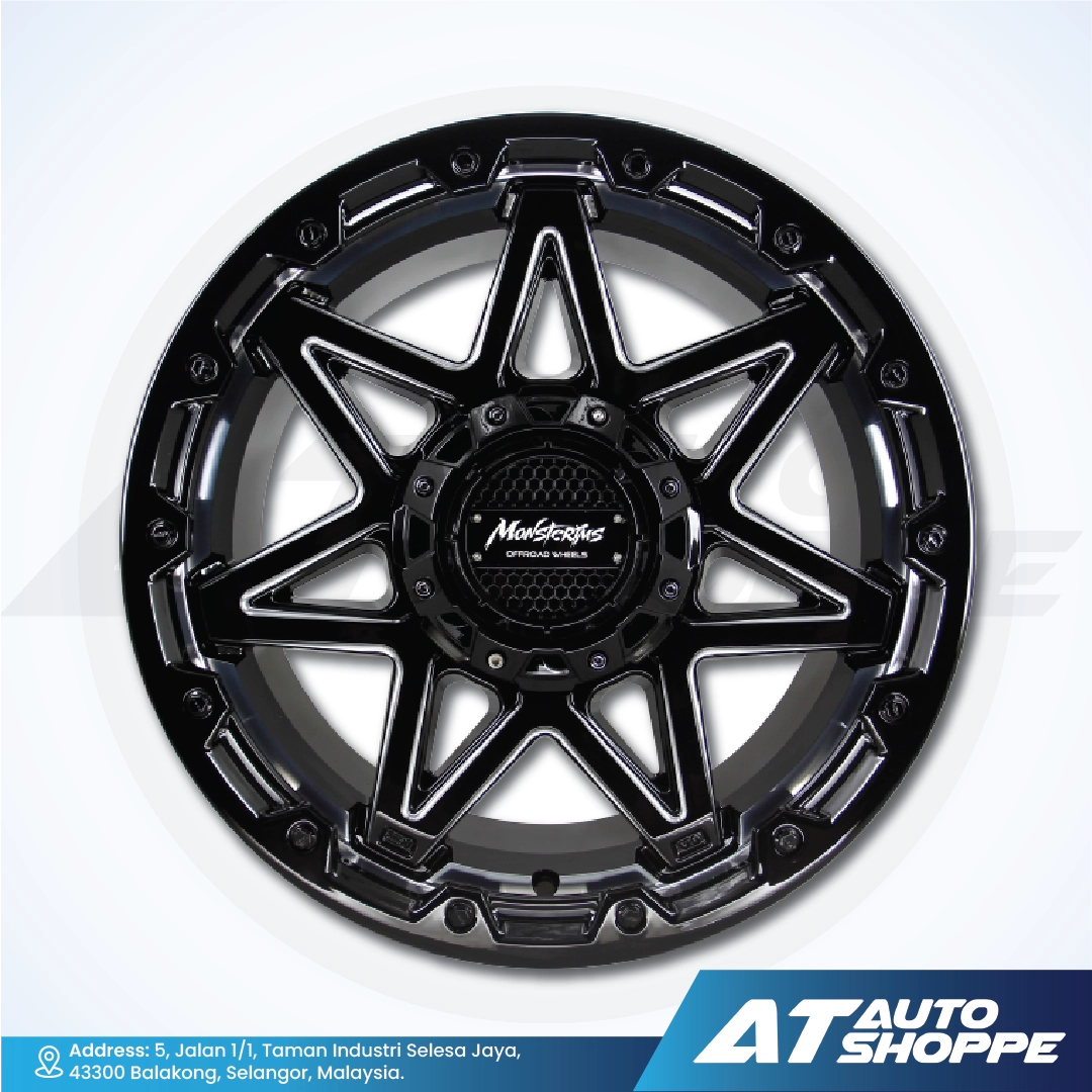 Black star-patterned wheel rim on a white background with AT Auto Shoppe branding.