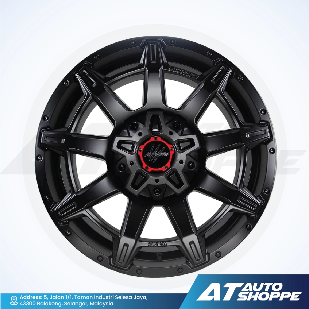 Monsterims wheel with red center on a white background, featuring the AT Auto Shoppe logo.