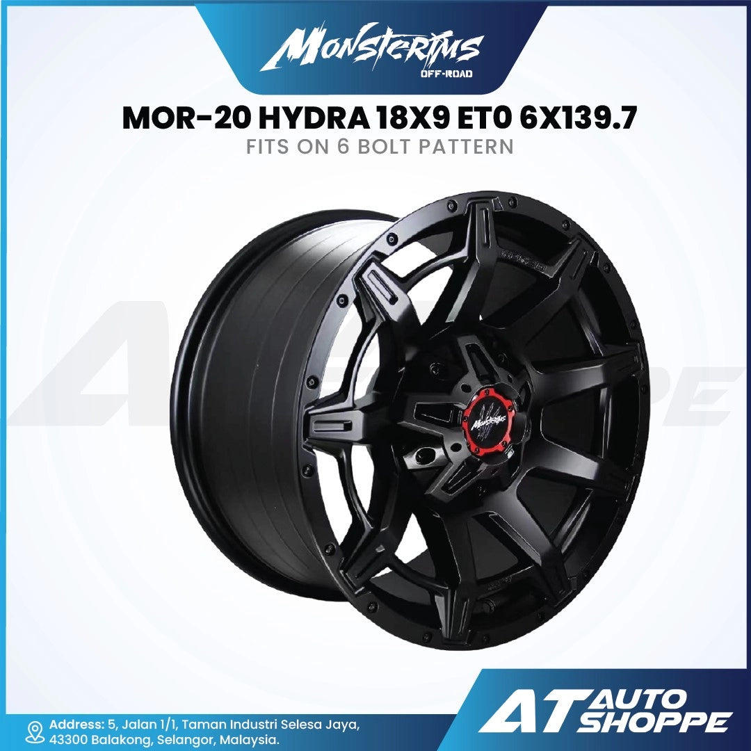 Monsterims wheel rim with red center on a white background, featuring AT Auto Shoppe branding.