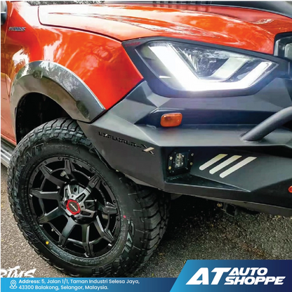 Close-up of a red SUV withMonsterims wheel and visible branding at AT Auto Shoppe.