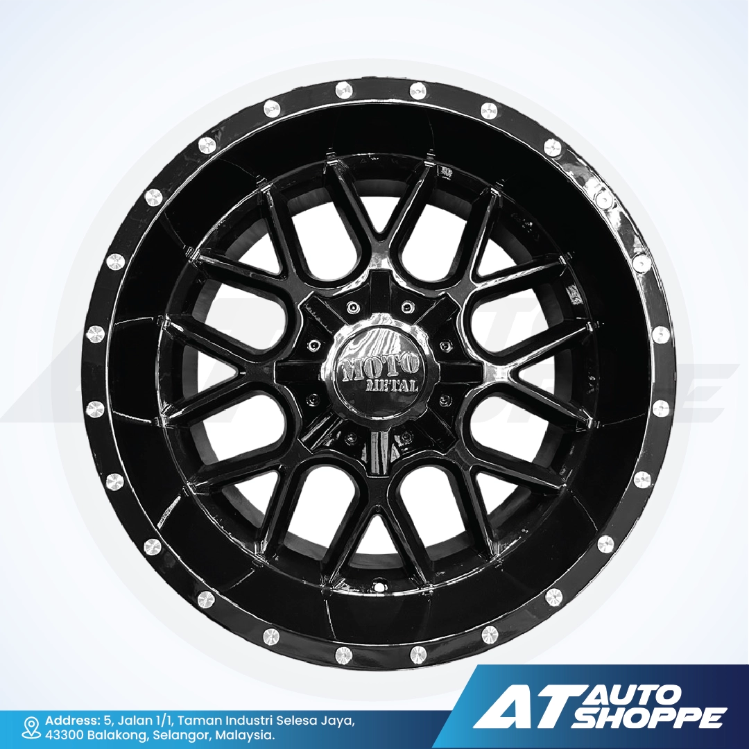 Black alloy wheel with silver accents on a white background, featuring the AT Auto Shoppe logo.