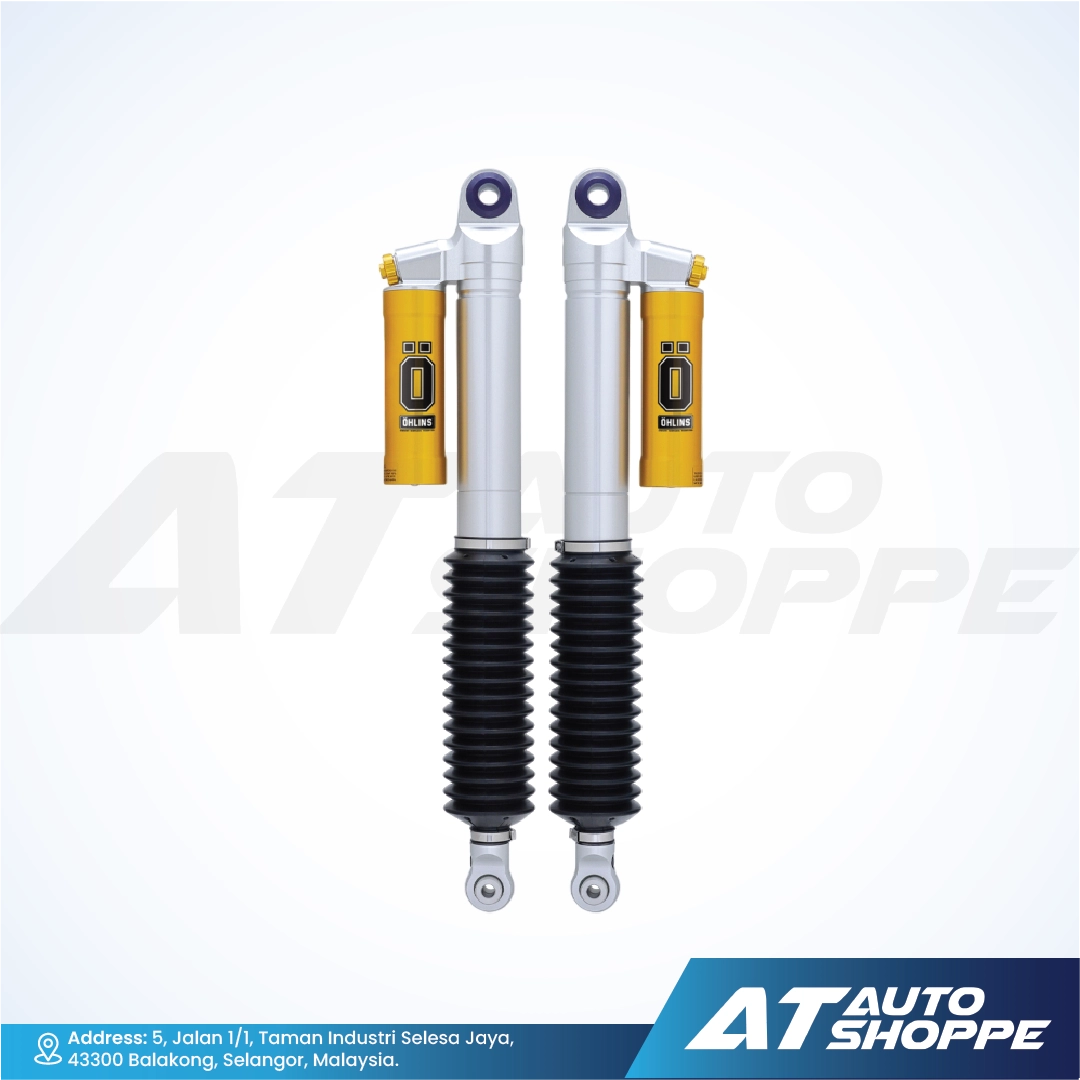 Ohlins shock absorbers with yellow and black components on a white background, featuring AT Auto Shoppe branding.