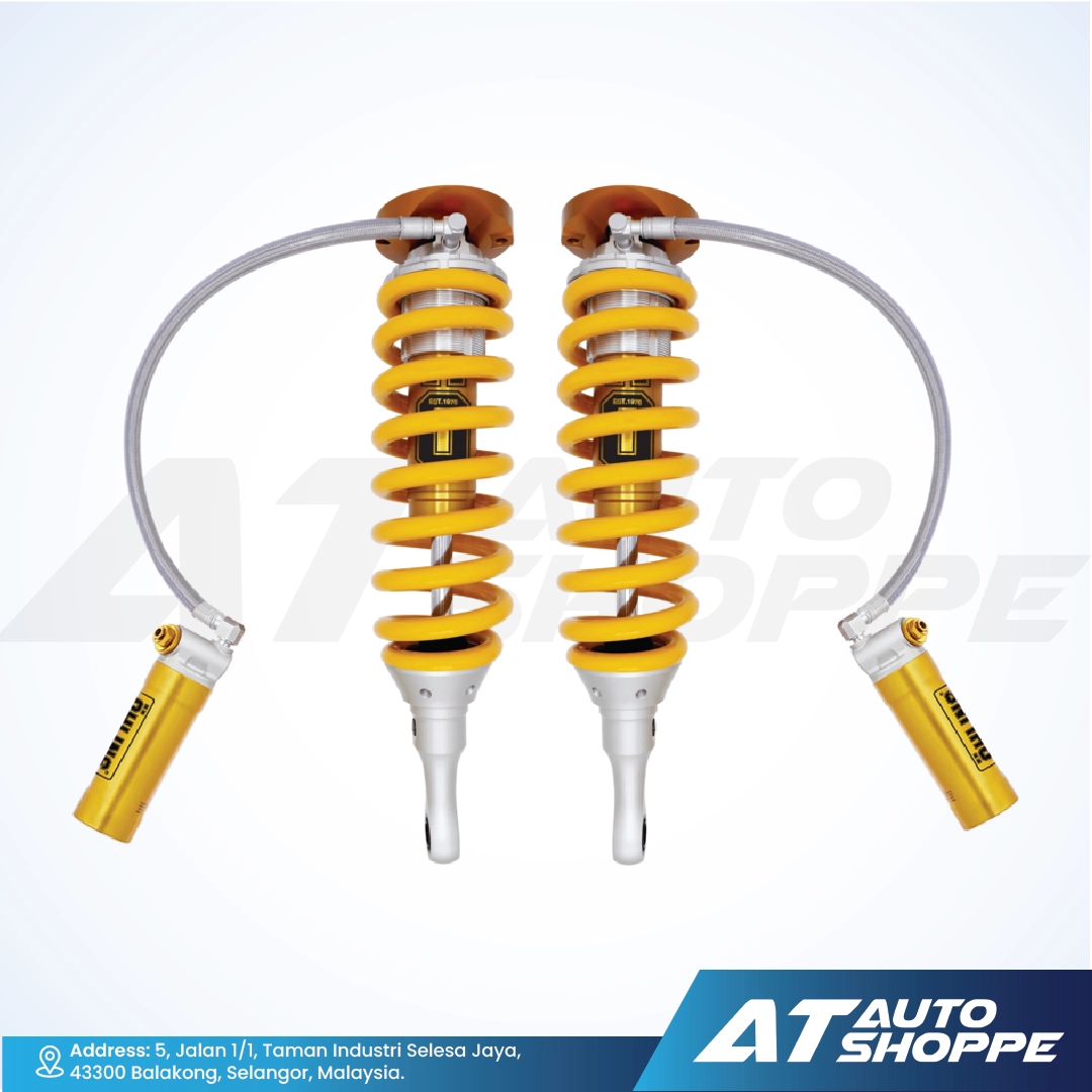 Ohlins yellow coilover absorbers on a white background with AT Auto Shoppe branding.