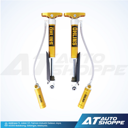 Ohlins shock absorbers with gold and black design on a white background, featuring the brand.