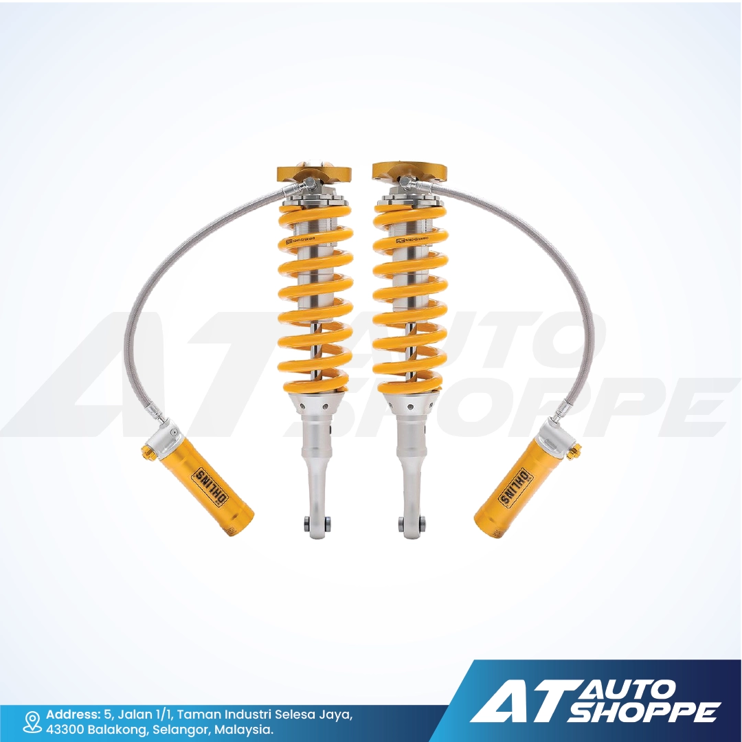 Two Ohlins shock absorbers with yellow springs on a white background, branded 'AT Auto Shoppe'.