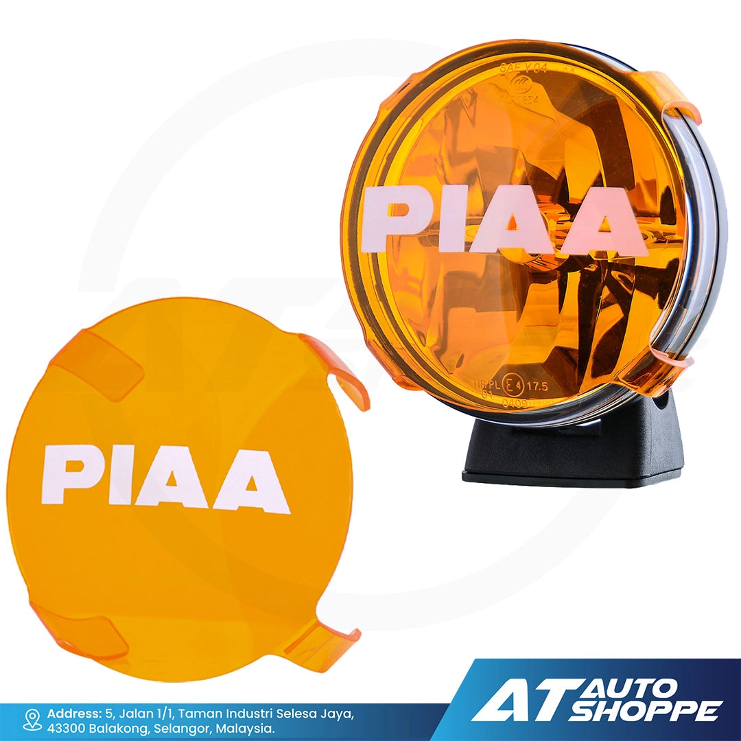 Two orange PIAA automotive lights with a white background and AT Auto Shoppe logo.