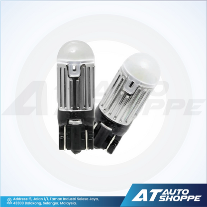 Two car light bulbs on a white background with AT Auto Shoppe branding.