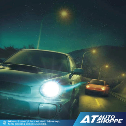 Two cars on a road at night with streetlights illuminating the scene, featuring the AT Auto Shoppe logo.