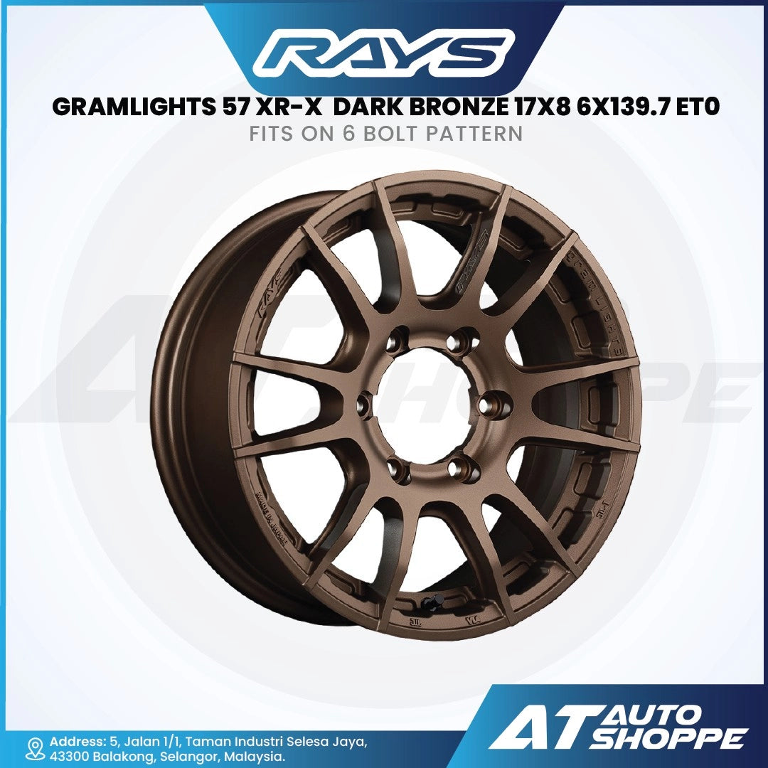 Brown car wheel rim with 'RAYS' branding on a white background
