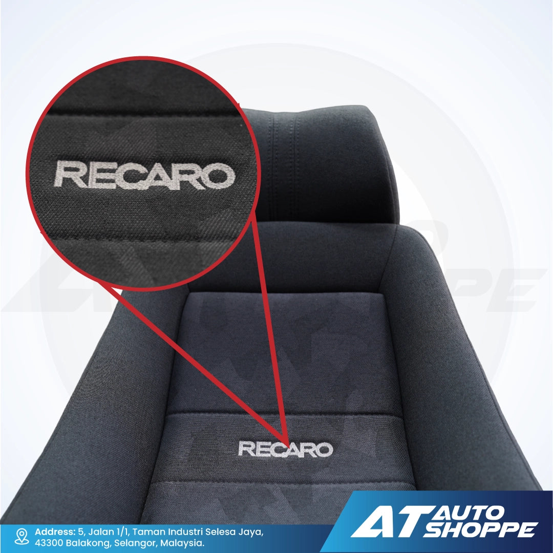 Recaro car seat with close-up of brand logo on a white background, featuring AT Auto Shoppe branding.