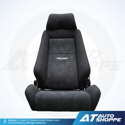Black car seat with Recaro branding on a white background, featuring AT Auto Shoppe logo.