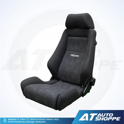 Black car seat with Recaro branding on a white background, featuring AT Auto Shoppe logo.
