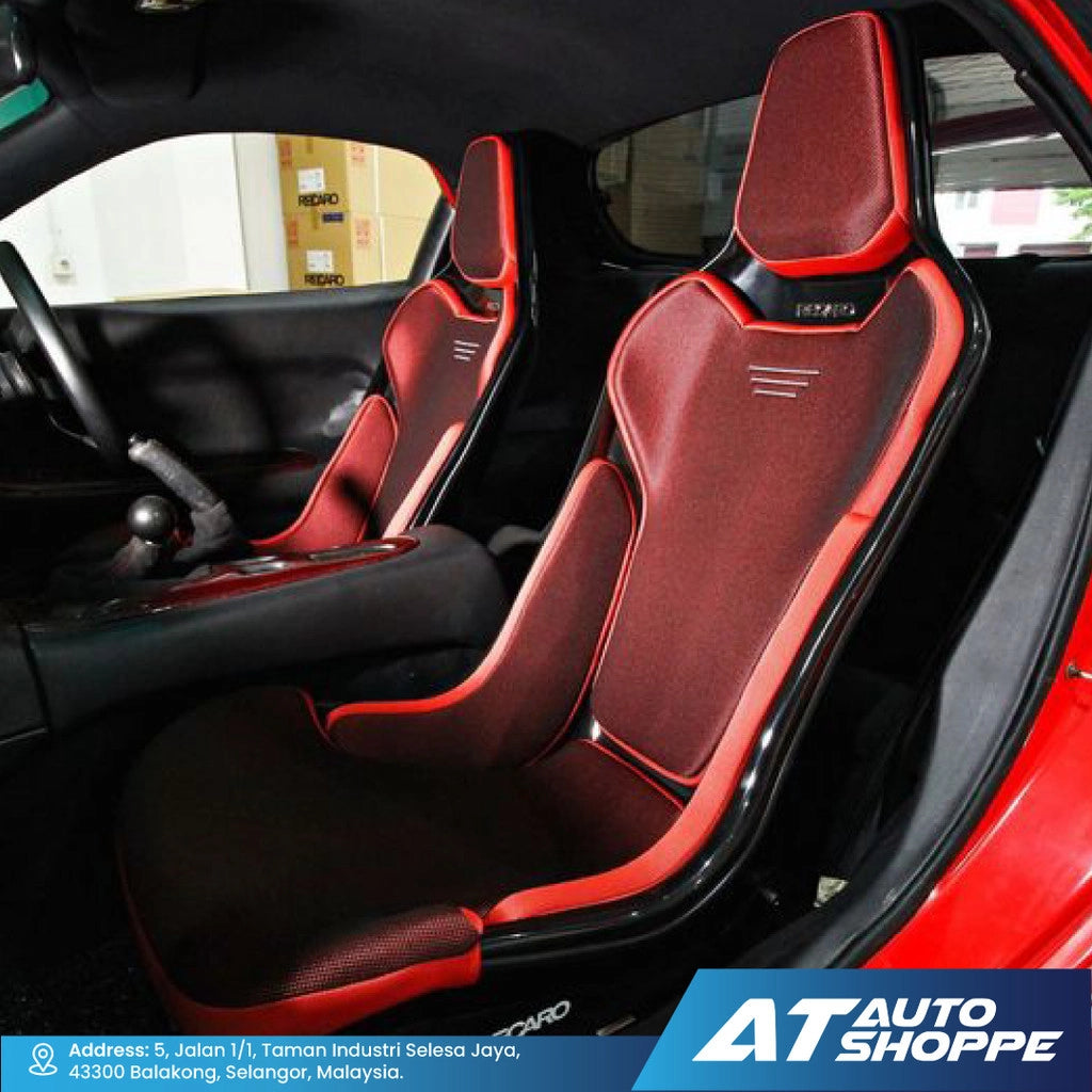 Red and black car seats with 'AT Auto Shoppe' branding.