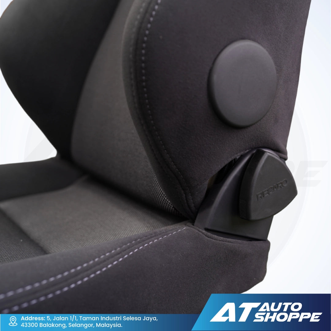 Close-up of a car seat with a headrest adjustment knob on a white background.