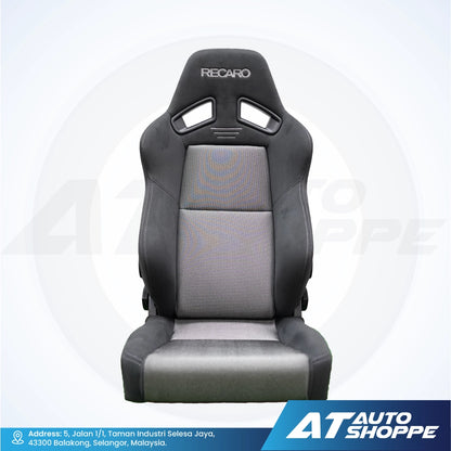 Grey and black Recaro car seat on a white background.