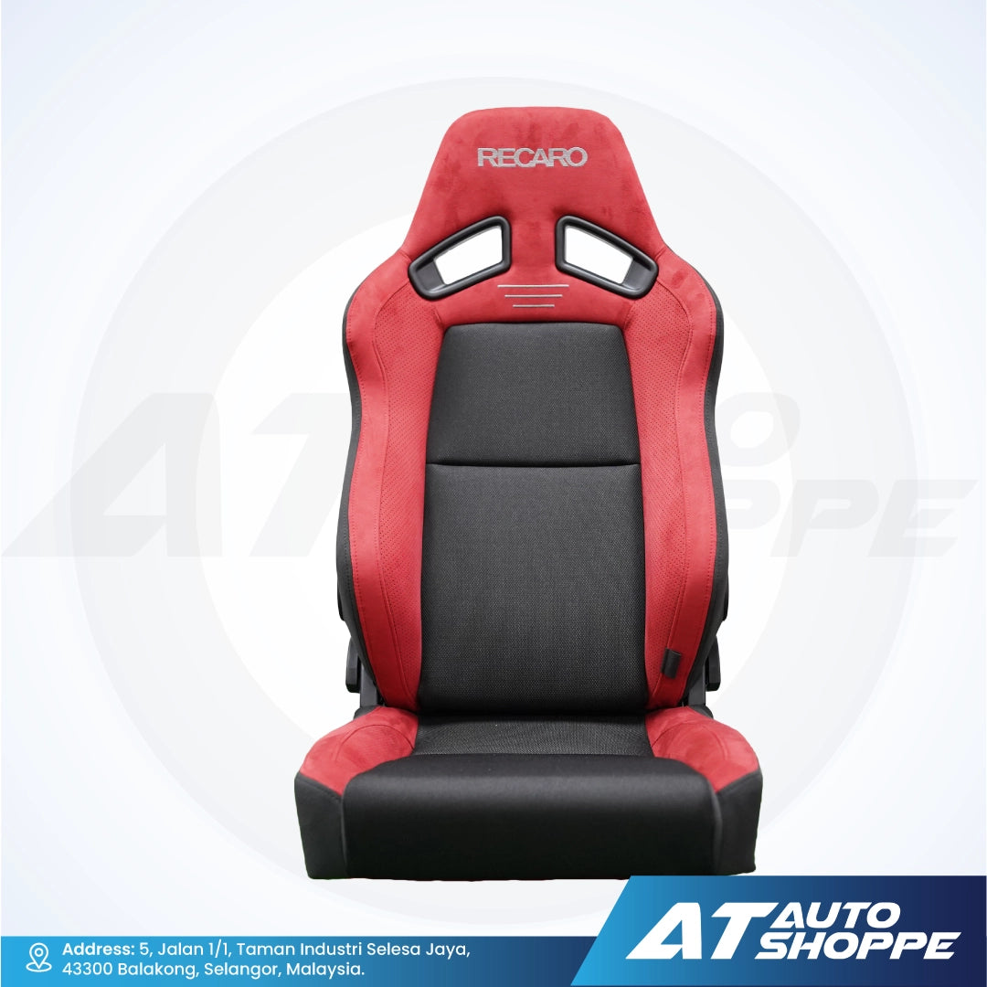 Red and black Recaro car seat on a white background with AT Auto Shoppe branding.