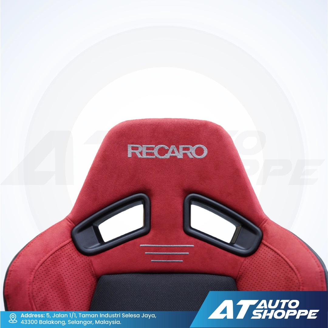 Red Recaro car seat with black accents on a white background, featuring AT Auto Shoppe branding.
