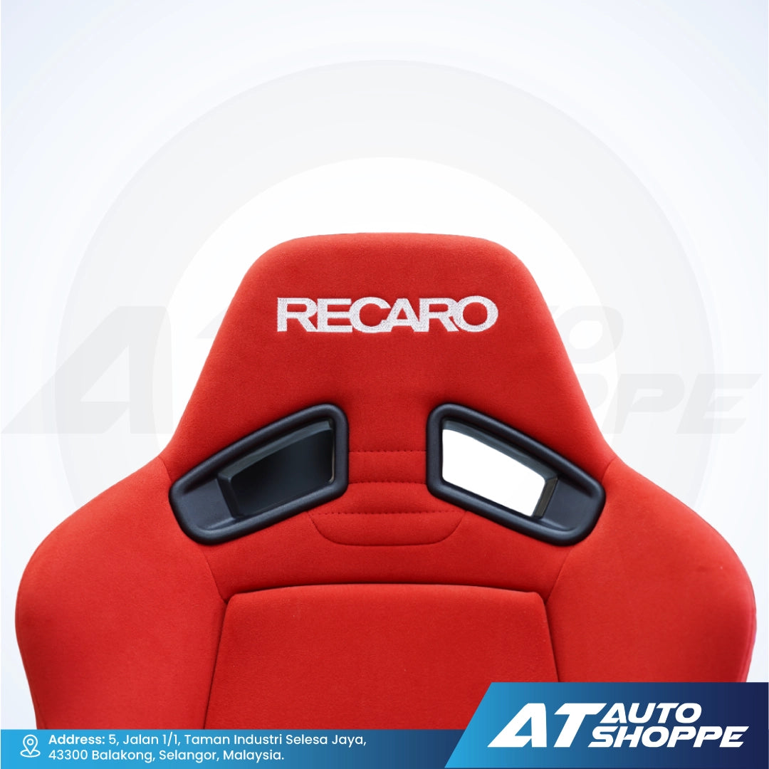 Red Recaro car seat with black accents on a white background, featuring AT Auto Shoppe branding.