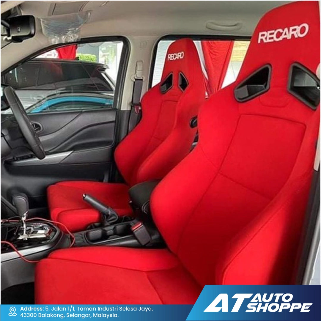 Red Recaro car seats inside a vehicle with AT Auto Shoppe branding.