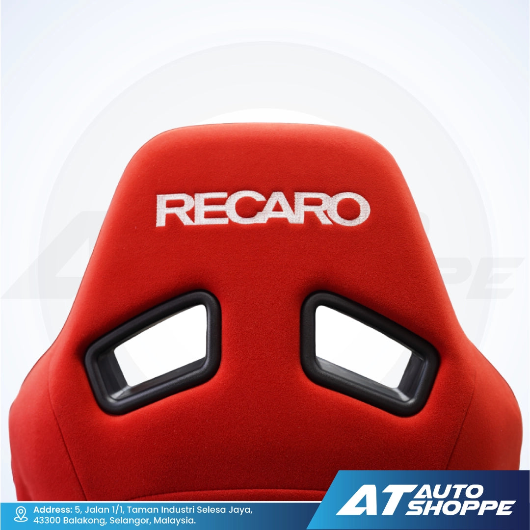 Red Recaro car seat with a white background and AT Auto Shoppe branding.