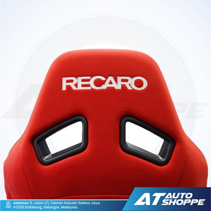 Red Recaro car seat with a white background and AT Auto Shoppe branding.