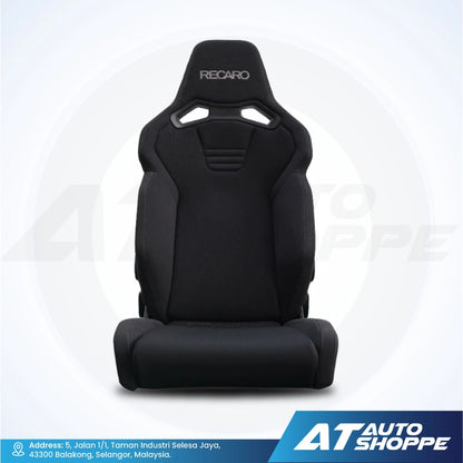 Recaro black car seat with branding on a white background, featuring AT Auto Shoppe logo.