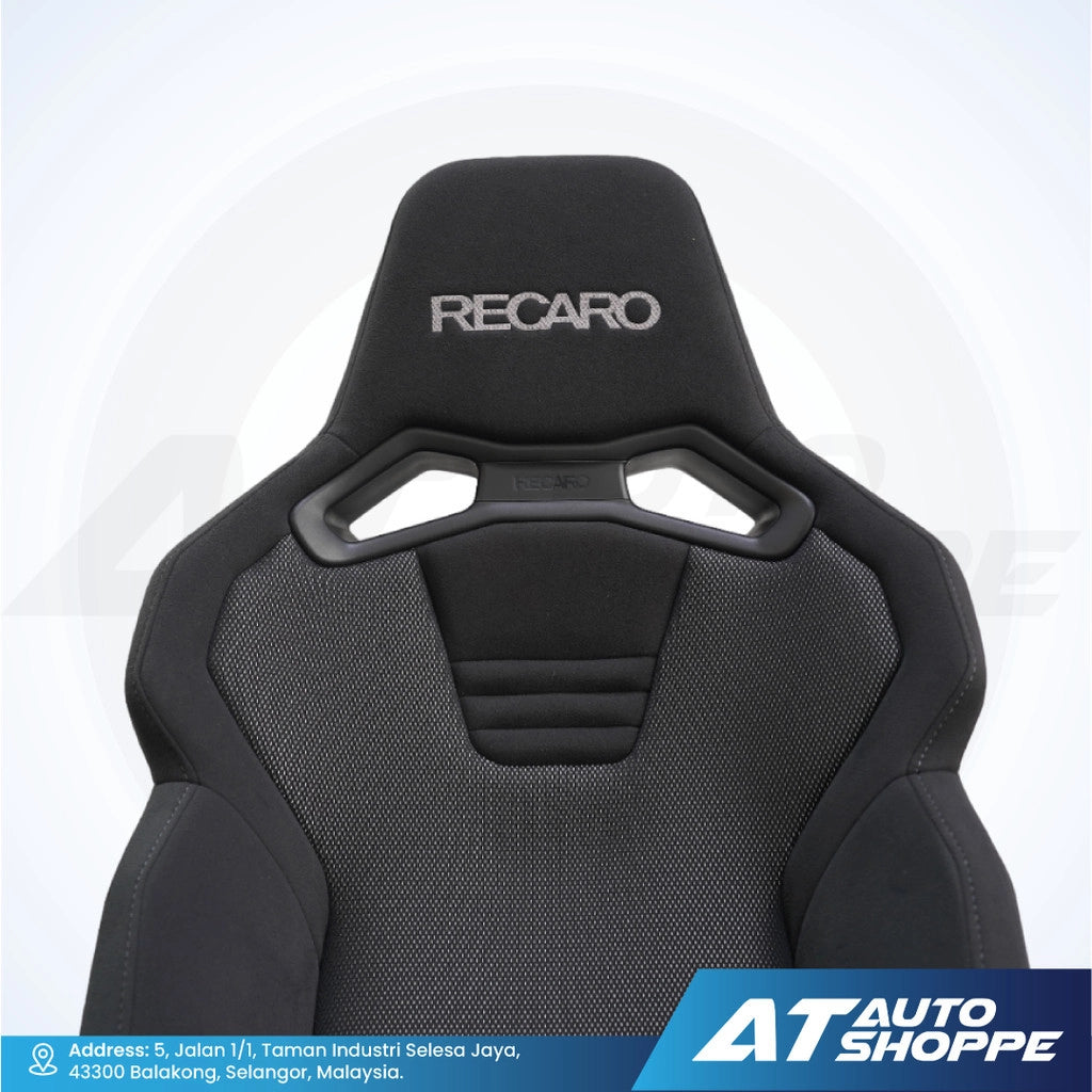 Black Recaro car seat on a white background with AT Auto Shoppe branding.