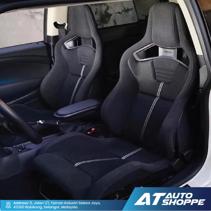 Recaro car interior with black racing seats and AT Auto Shoppe branding.