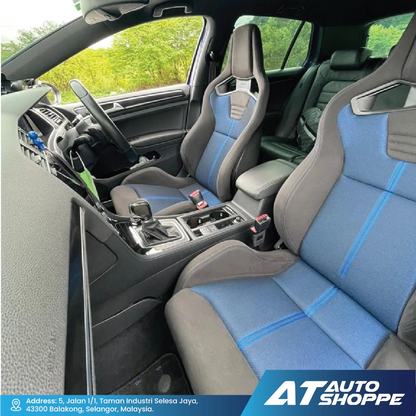 Recaro rar interior with blue and gray seats, dashboard, and steering wheel.