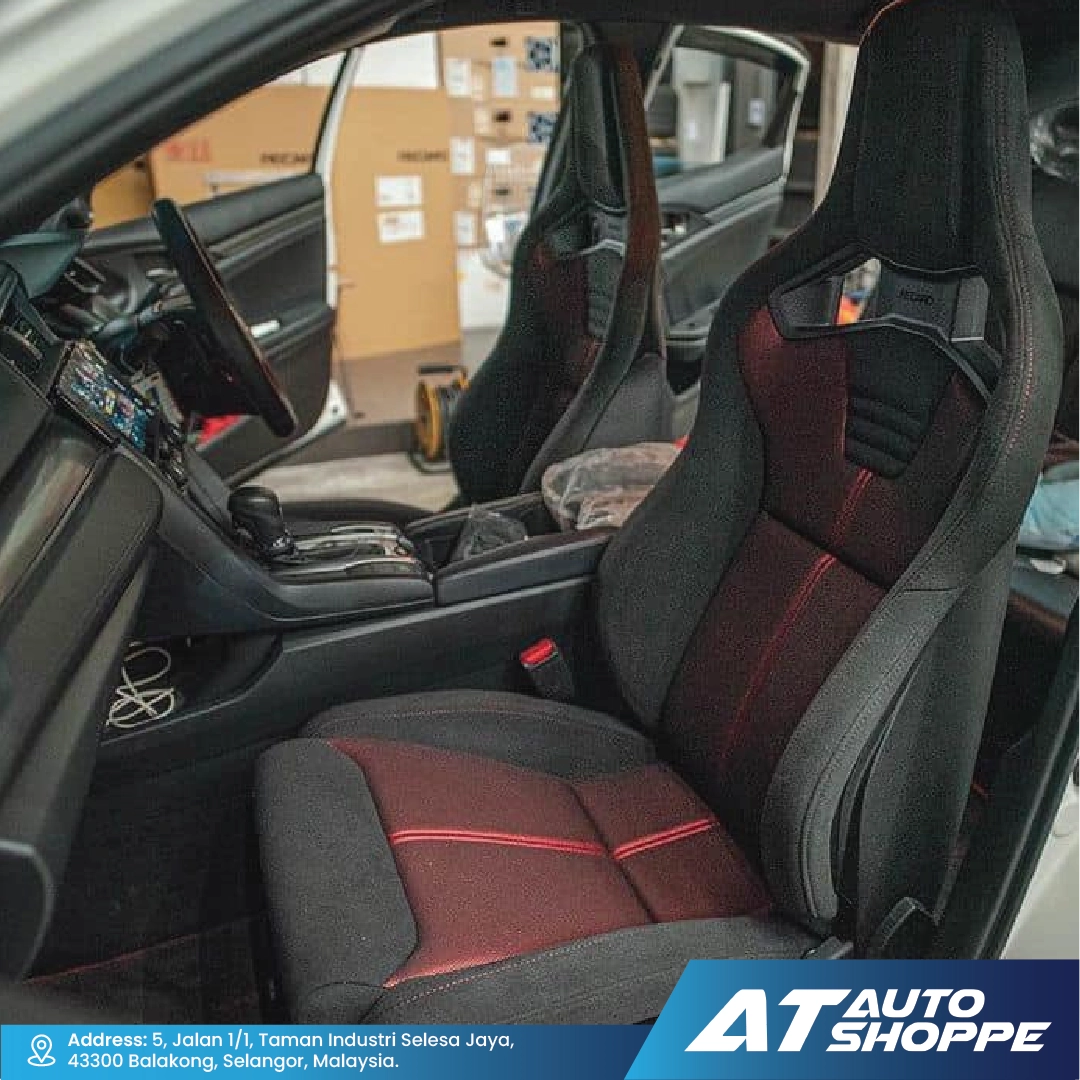 Recaro car interior with black and red seats, showing the AT Auto Shoppe branding.