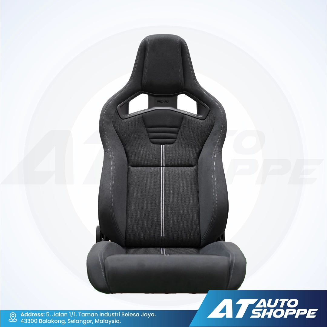 Recaro black car seat with white stitching on a white background, featuring the AT Auto Shoppe logo.