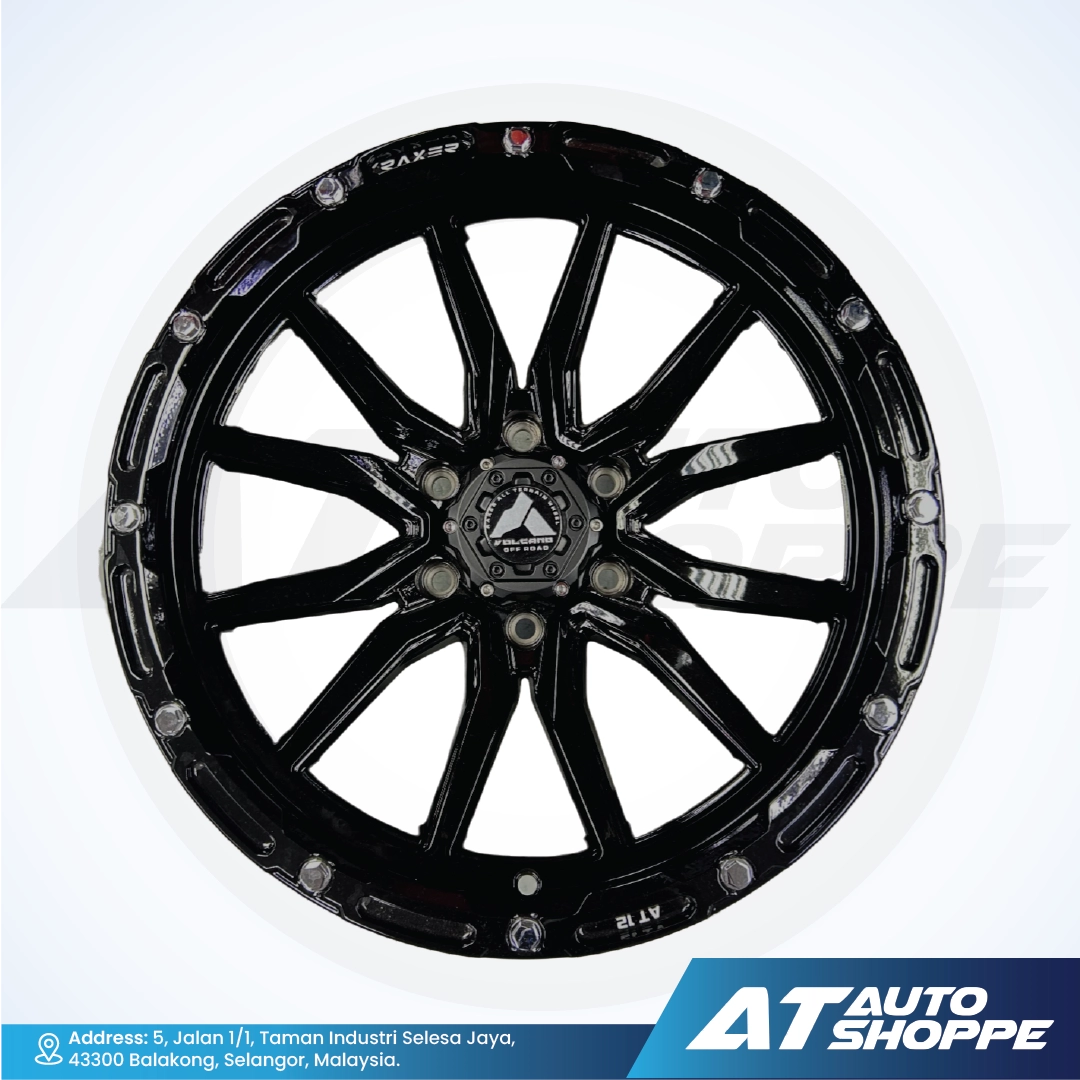 Black alloy wheel on a white background with AT Auto Shoppe branding.