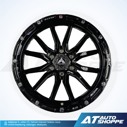Black alloy wheel on a white background with AT Auto Shoppe branding.