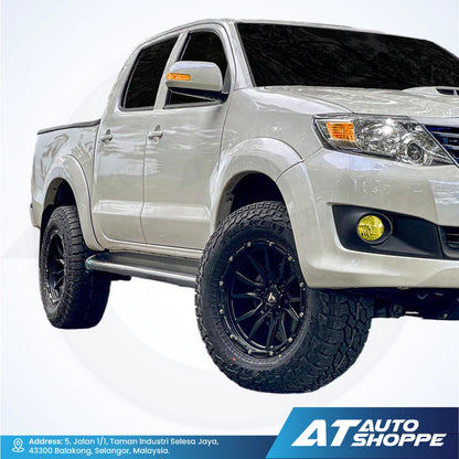 White pickup truck with black wheels on a white background, featuring AT Auto Shoppe branding.