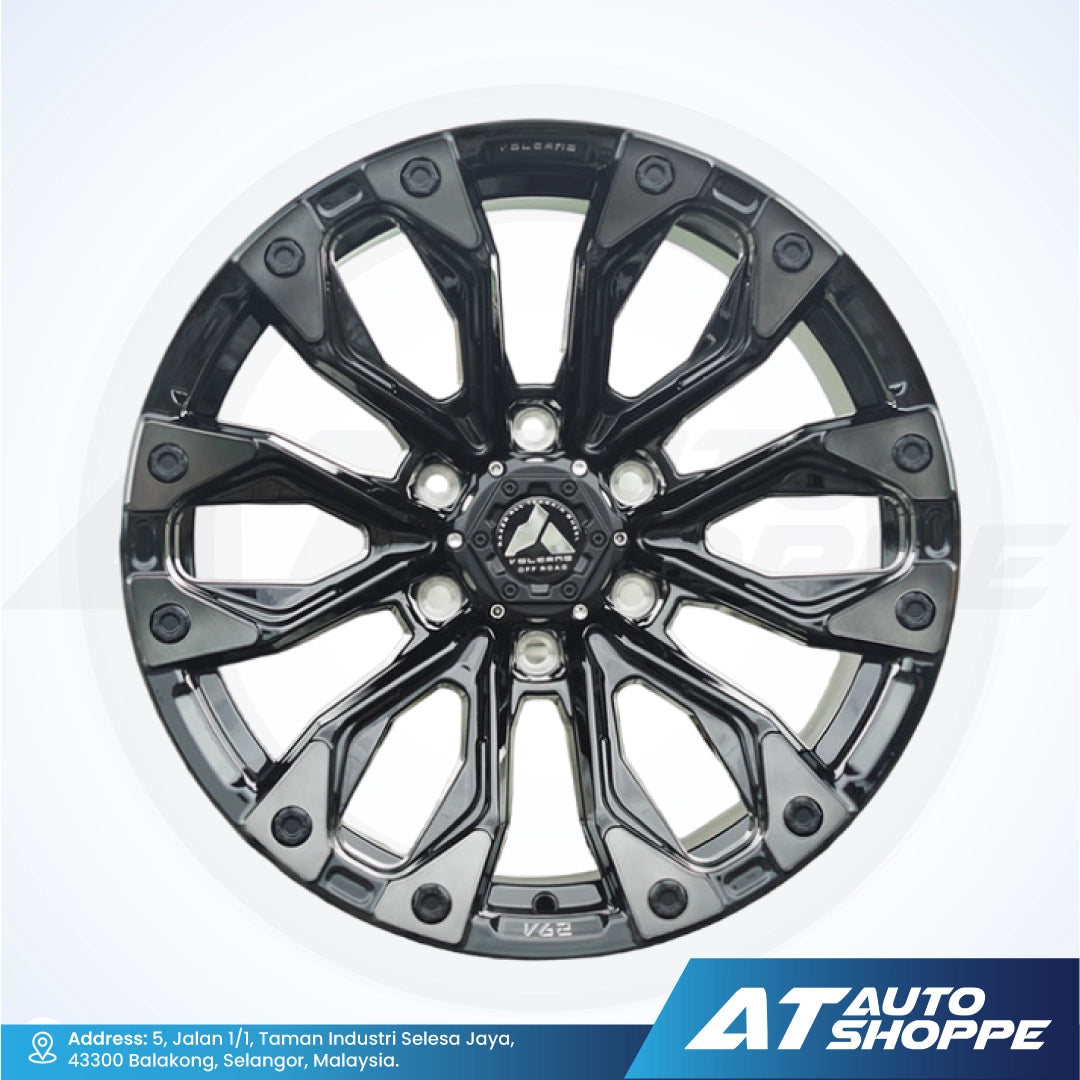 Black alloy wheel on a white background with AT Auto Shoppe branding.