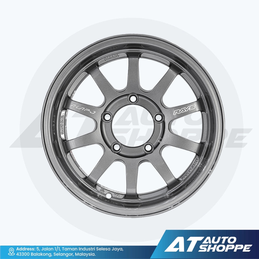 Car wheel rim with 'AT Auto Shoppe' branding on a white background