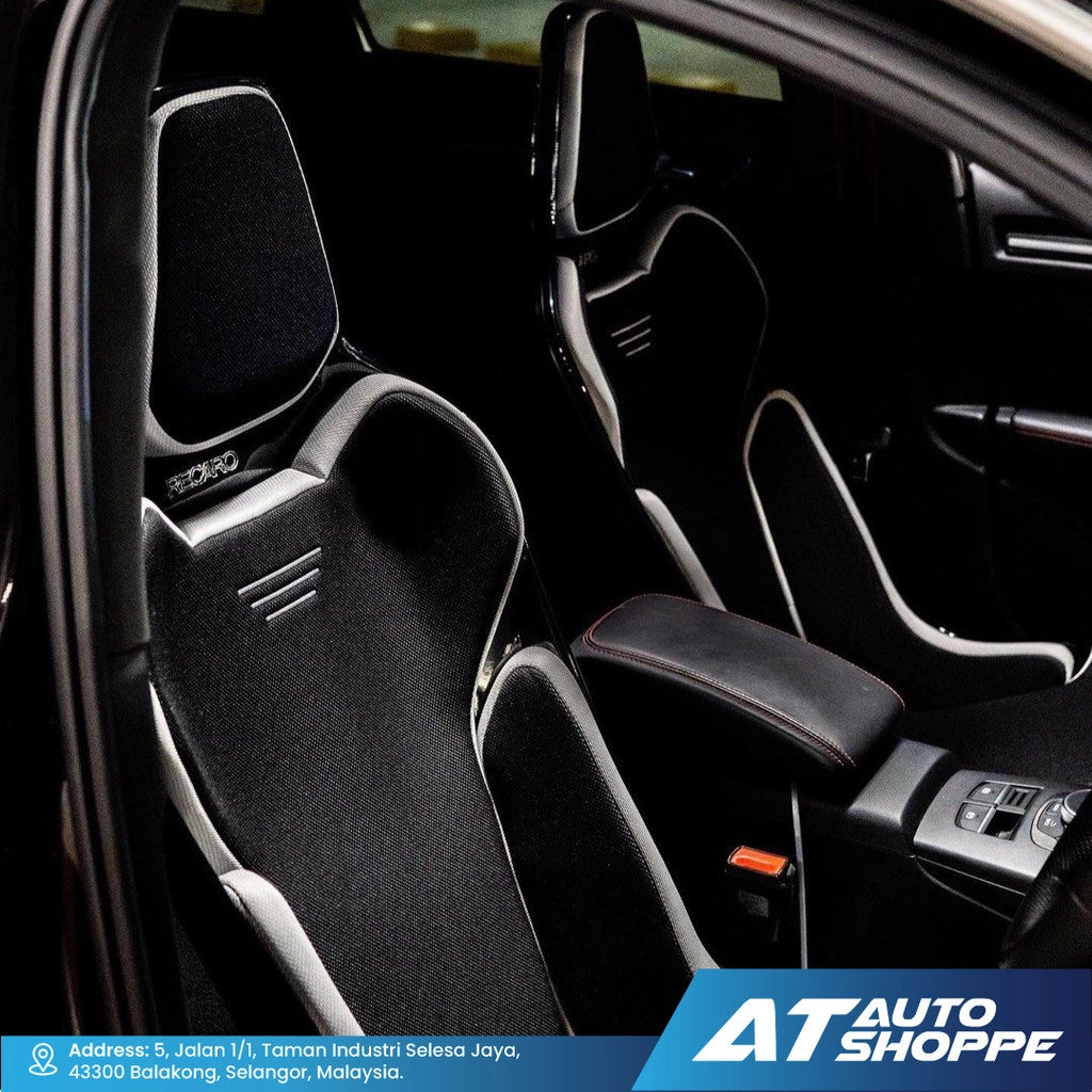 Car interior with black racing seats and visible branding of AT Auto Shoppe.
