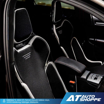 Car interior with black racing seats and visible branding of AT Auto Shoppe.