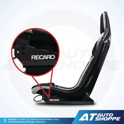 Black Recaro car seat with a close-up of the brand logo on a white background, featuring AT Auto Shoppe branding.