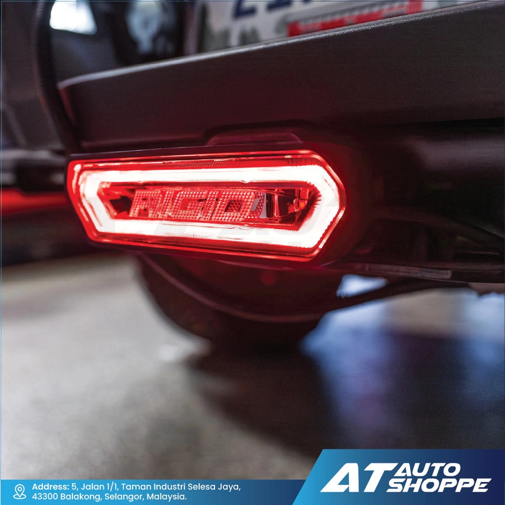 Rigid Industries car tail light with 'AT Auto Shoppe' branding in the corner