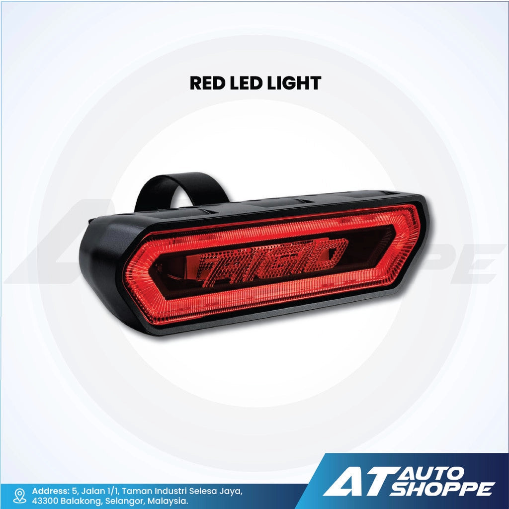 Rigid Industries Red LED light with 'AT Auto Shoppe' branding on a white background