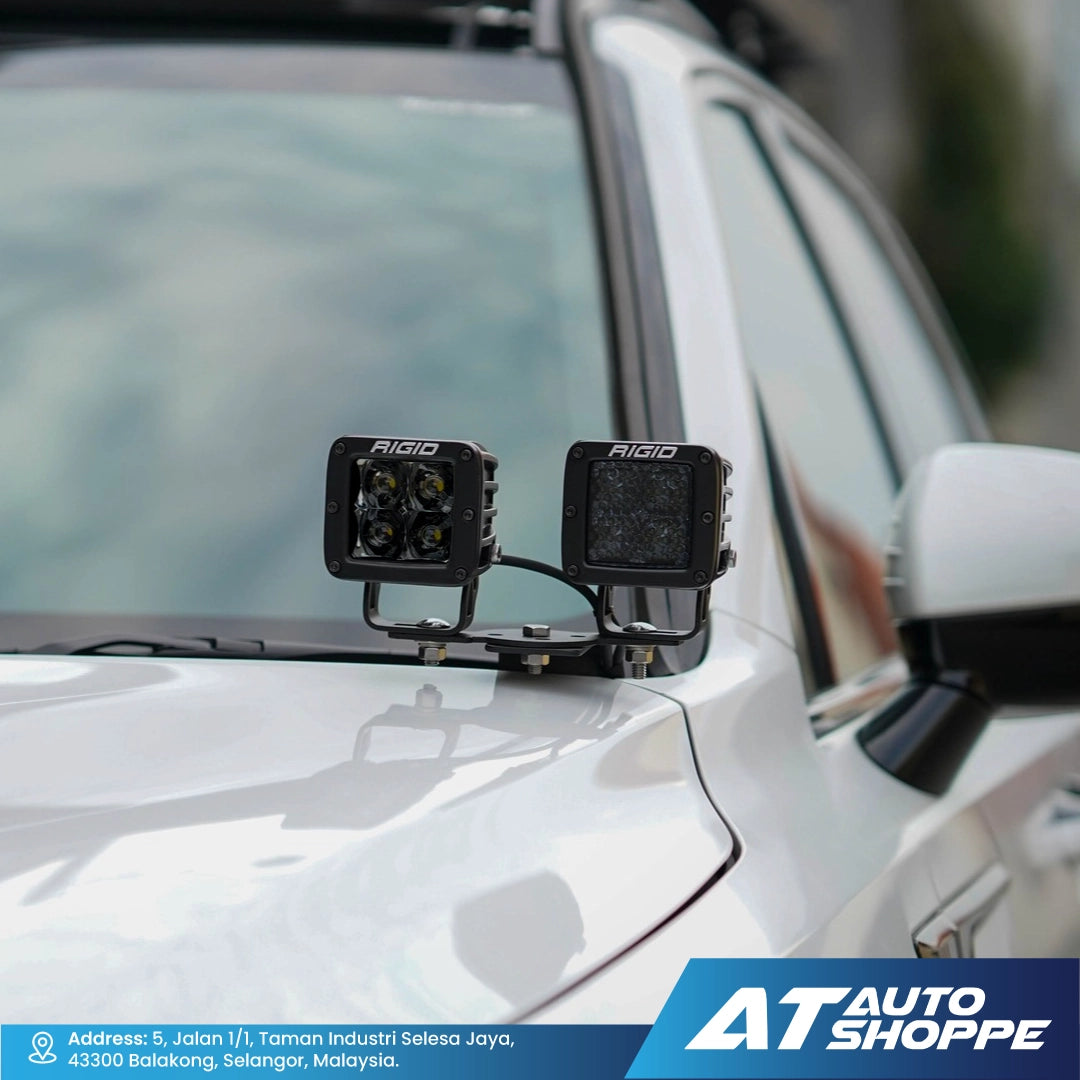 Two Rigid LED lights mounted on a vehicle's roof with AT Auto Shoppe branding.